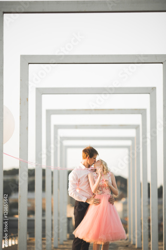 Lovers man and woman embracing each other outdoors