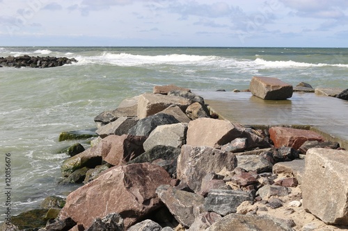 Dam and mole on the beach of Lonstrup. West coast of Denmark, North Jutland, Europe. photo