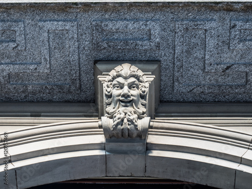 Photos Satyr head decoration above door