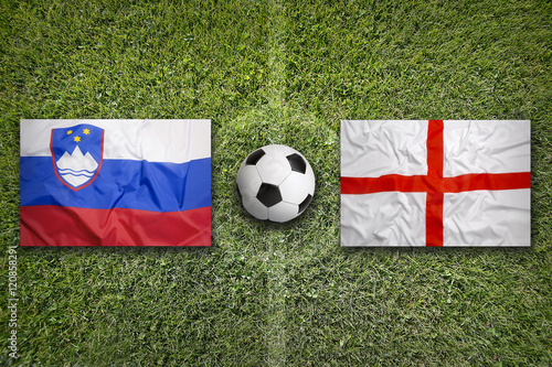 Slovenia vs. England flags on soccer field
