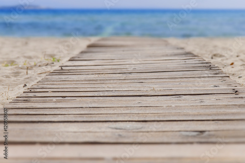 Beach wooden path and sea background