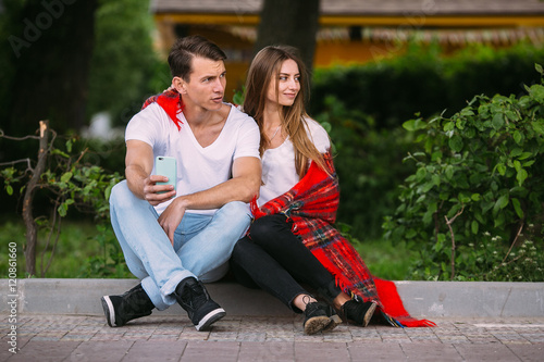 Beautiful young couple relaxing in the park