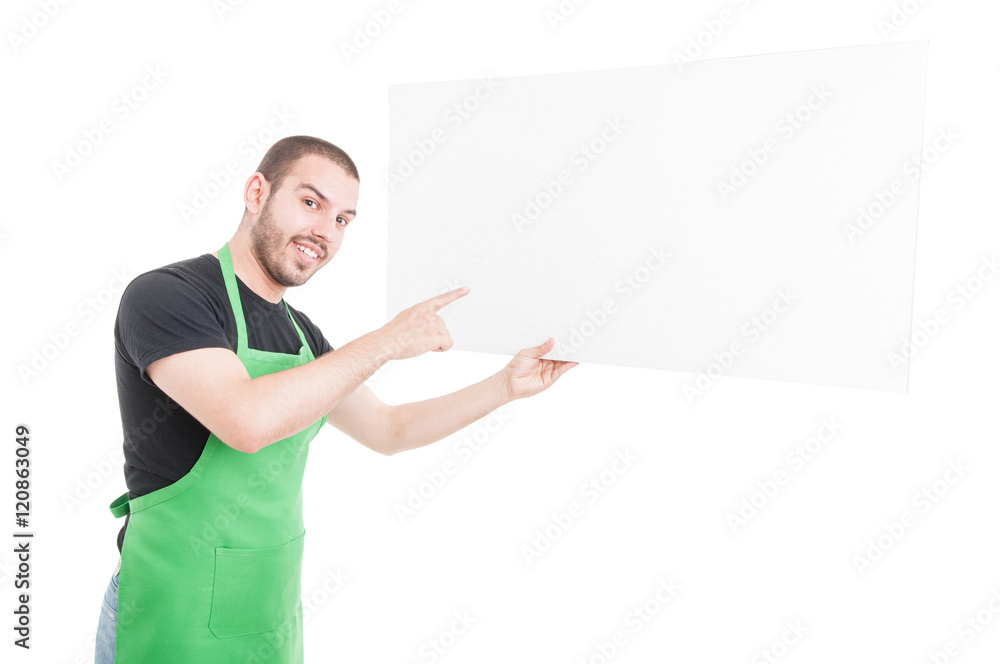Male employee pointing and holding big advertising board Male employee pointing and holding big advertising board