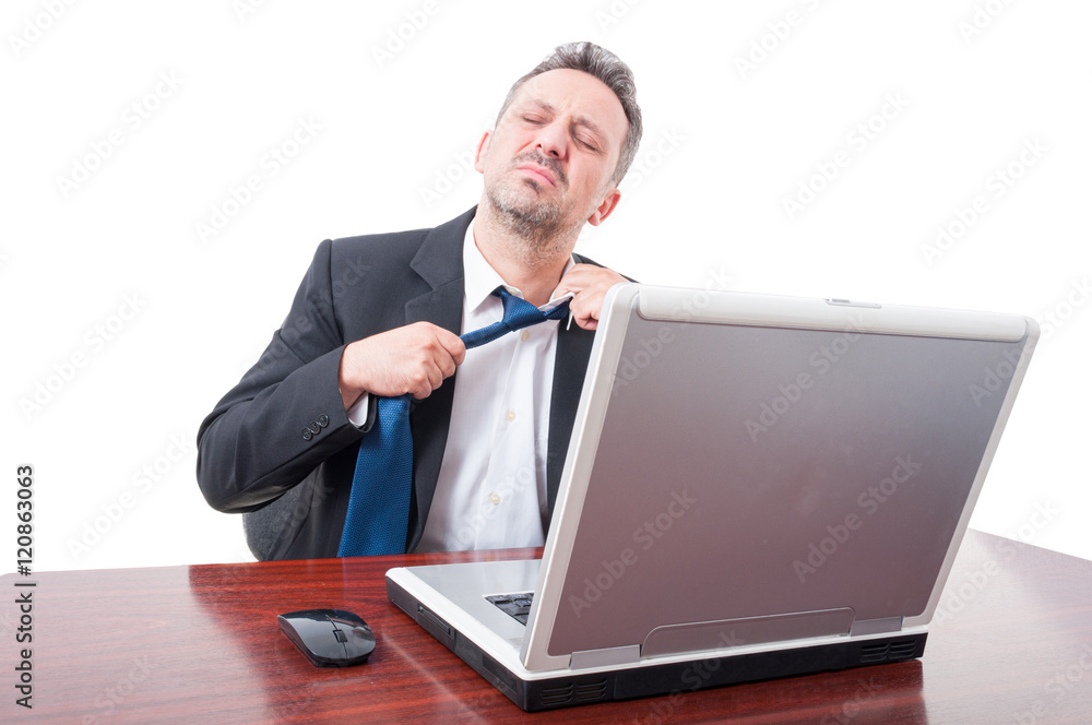 Man wearing suit at office being very tired Man wearing suit at office being very tired