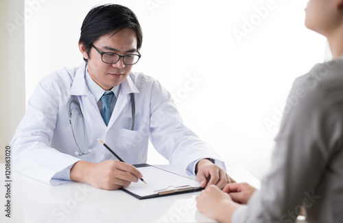 doctor talking with female patien isolate on white background