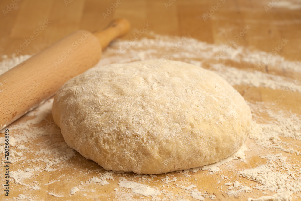 yeasty dough and rolling pin yeasty dough and rolling pin