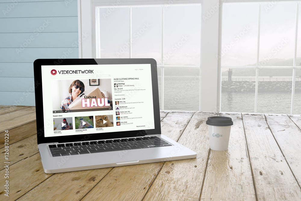 Fototapeta premium laptop with vlog on screen with port background and coffee
