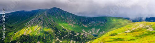 Picturesque Carpathian mountains landscape in summer, wide angle panoramic view, Ukraine.