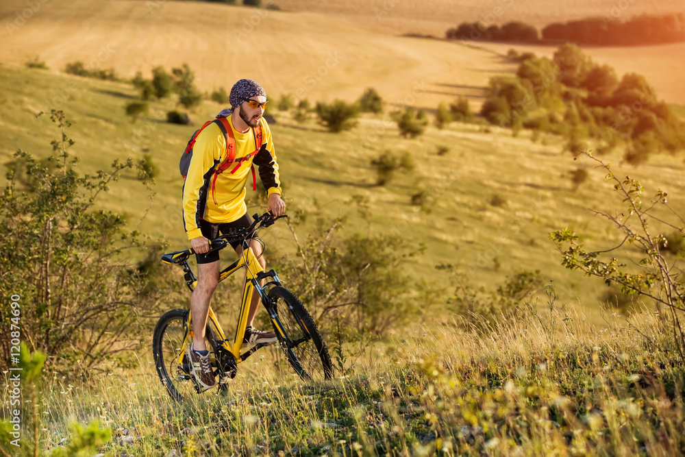 young bright man on mountain bike young bright man on mountain bike