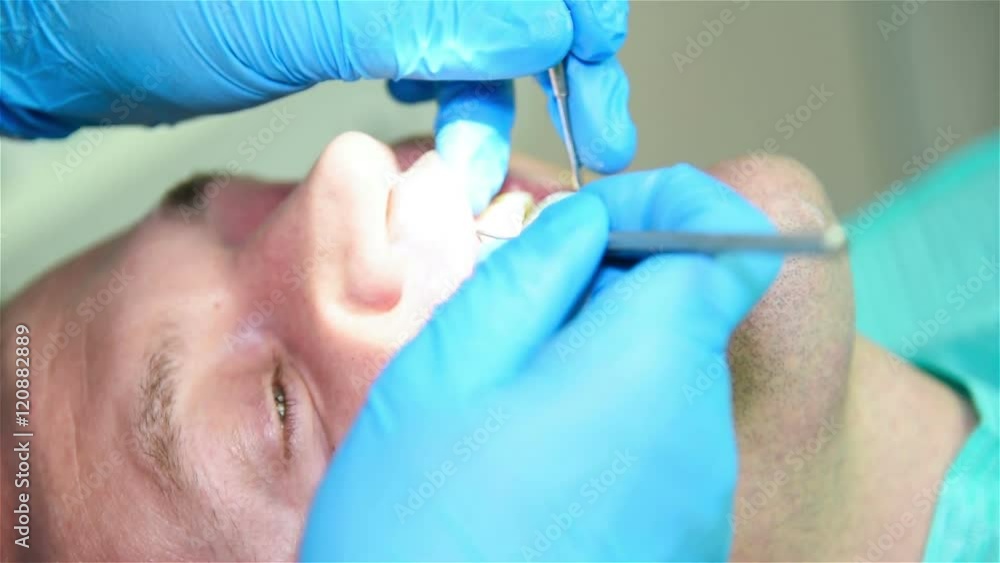 Dentist Examining Patient With Dental Probe And Mirror. Dentist Examining Patient With Dental Probe And Mirror.