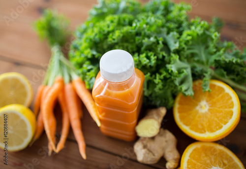 bottle with carrot juice, fruits and vegetables