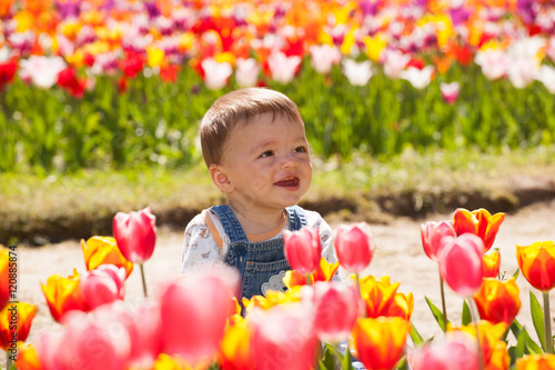 Baby among tulips
