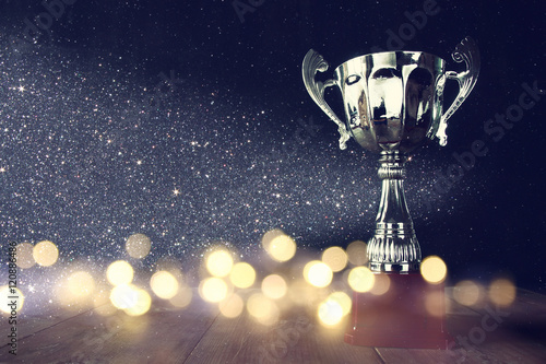 Fotografia, Obraz low key image of trophy over wooden table