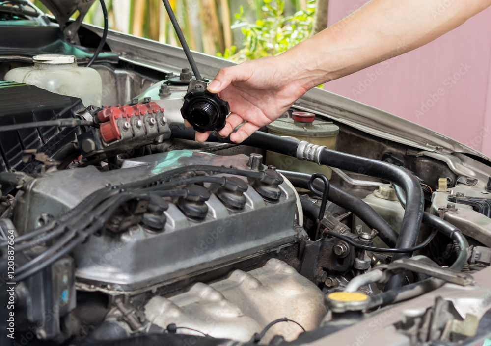 Fototapeta premium open engine oil cap for checking