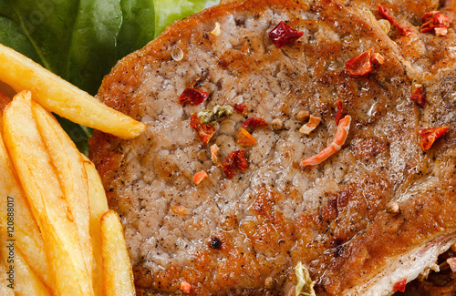 Juicy roasted pork steak wi...
