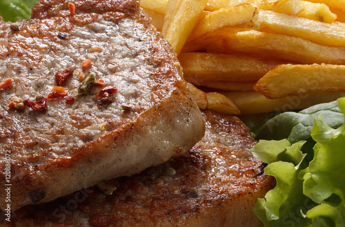 Juicy roasted pork steak wi...