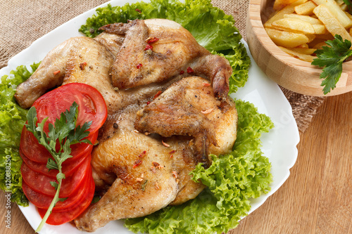 Chicken fried with potato and vegetables