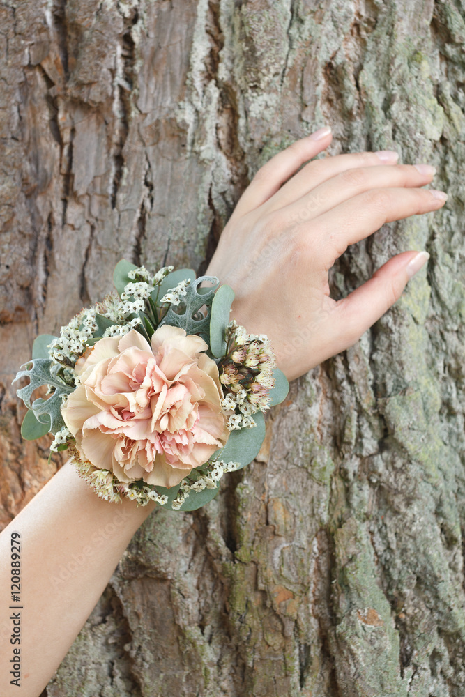 Dusty pink carnation wrist corsage on a hand Stock Photo Adobe Stock