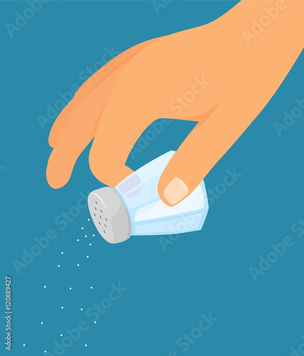 Hand using a salt shaker