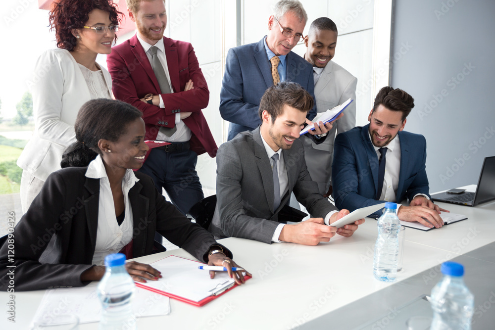 Fototapeta premium Business team read data from tablet at meeting