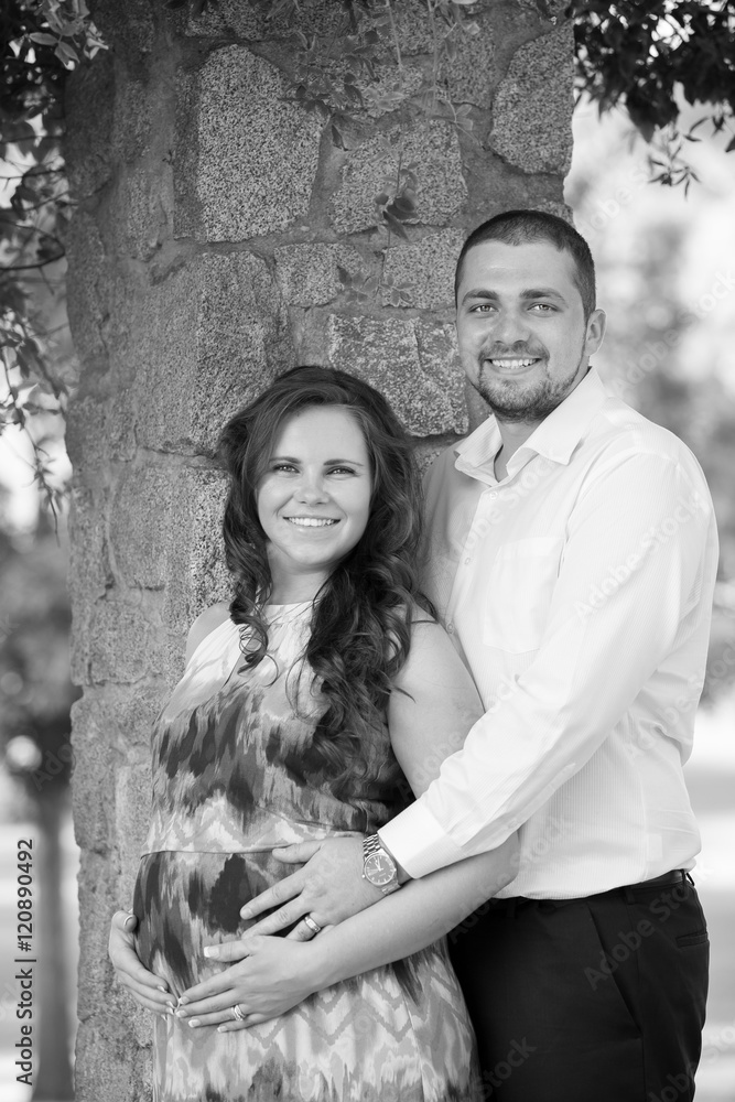 Beautiful, happy pregnant couple in park Beautiful, happy pregnant couple in park