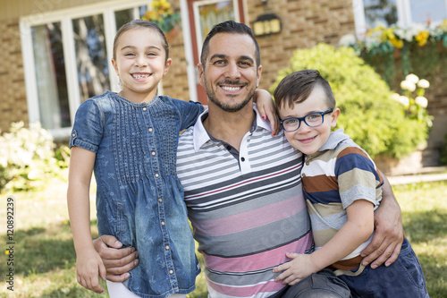Картината върху платно Portrait of happy family in front  house