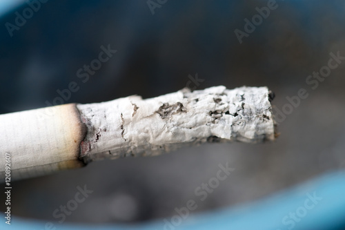 Cigarette / smoldering cigarette in an ashtray