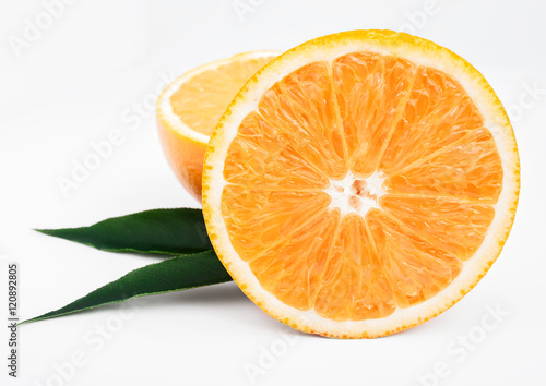 Fresh juicy oranges with leafs. on white background