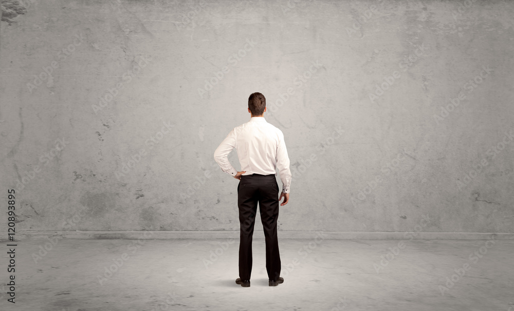 Businessman lost in empty urban space Businessman lost in empty urban space