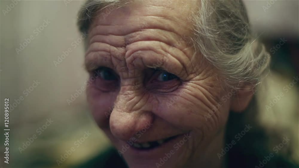 Old woman smiling and laughing. Old woman face with deep wrinkles. Old woman smiling and laughing. Old woman face with deep wrinkles.