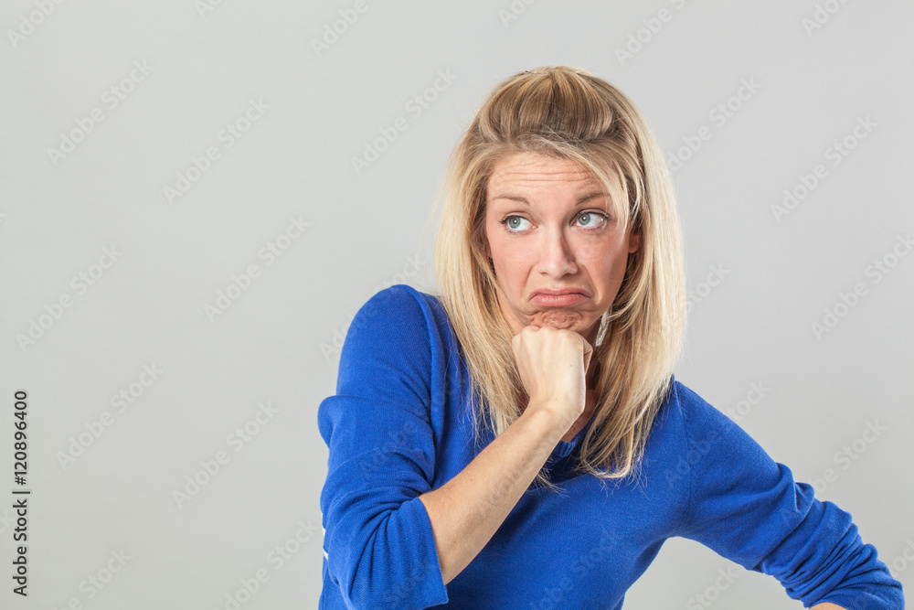 bored young blond woman expressing disappointment and unhappiness bored young blond woman expressing disappointment and unhappiness