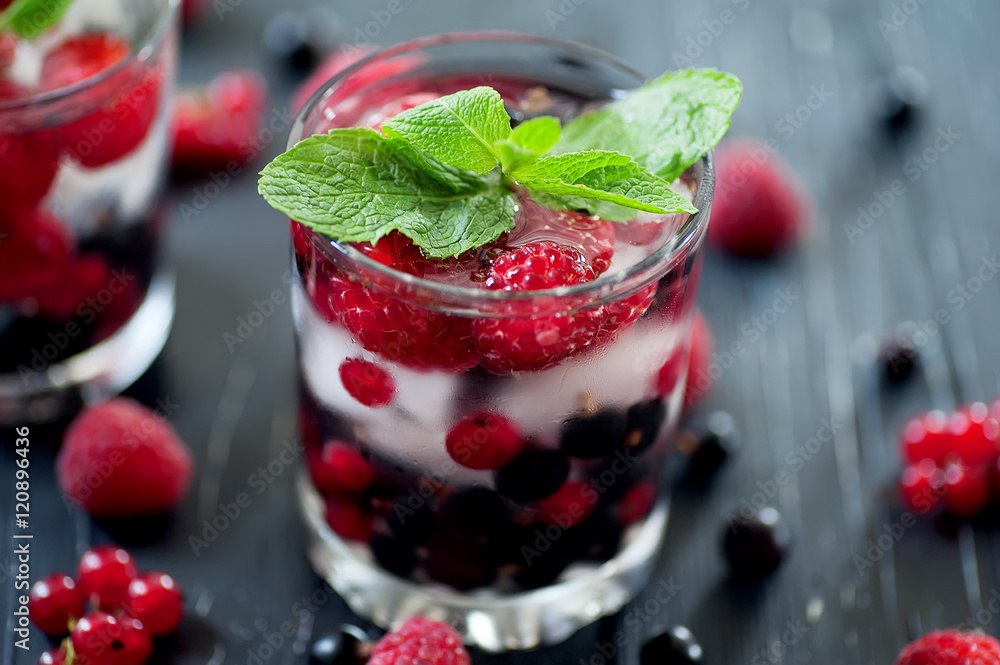 fruit coctaile and color berries on natural dark wooden desk fruit coctaile and color berries on natural dark wooden desk