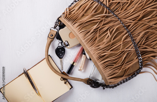 Still life of fashion woman. Feminine cosmetic background.Women's set of fashion accessories in beige tones.Copy space. selective focus.