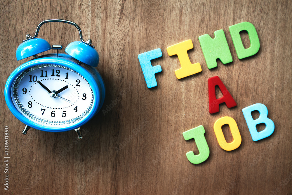 clock and find a job word writen on wooden background clock and find a job word writen on wooden background