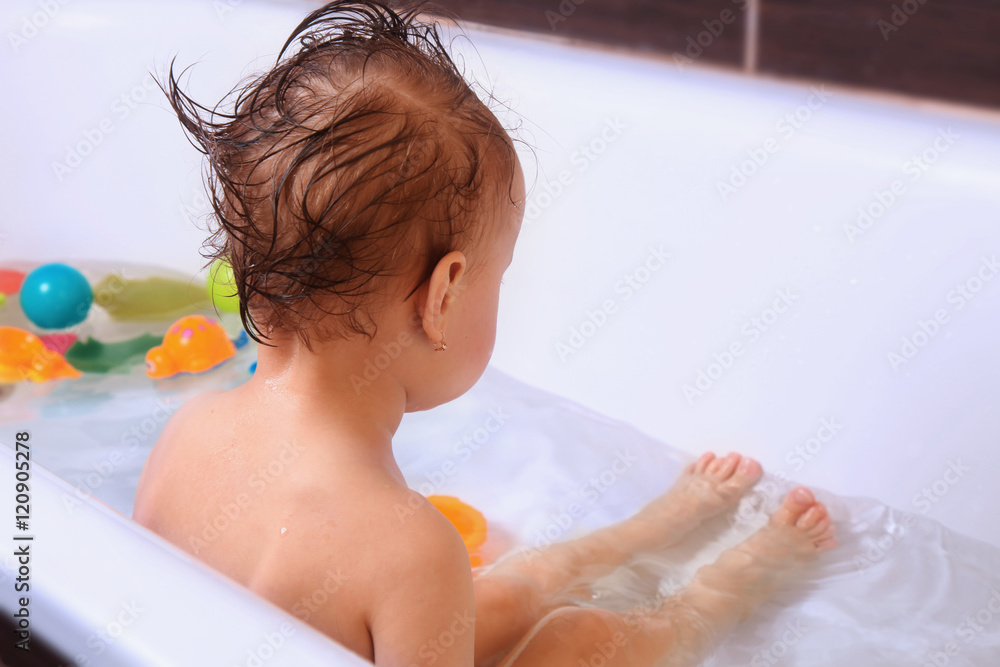 Beautiful baby girl  in the bath