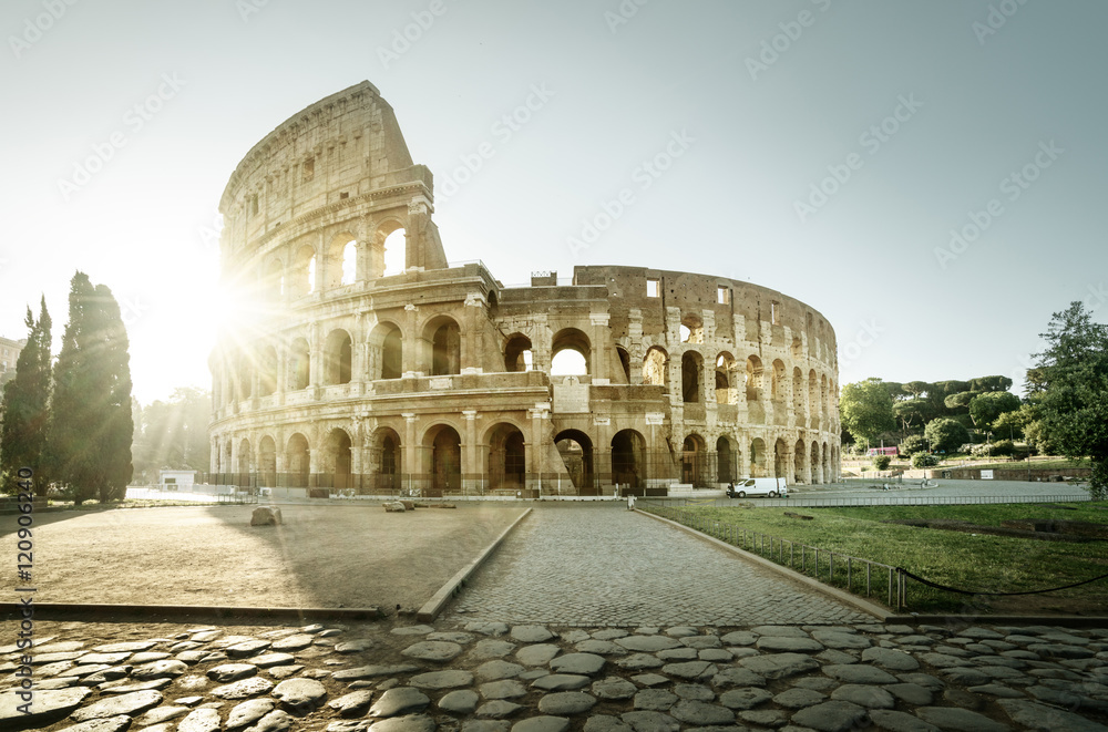 Colosseum in Rome and morning sun, Italy