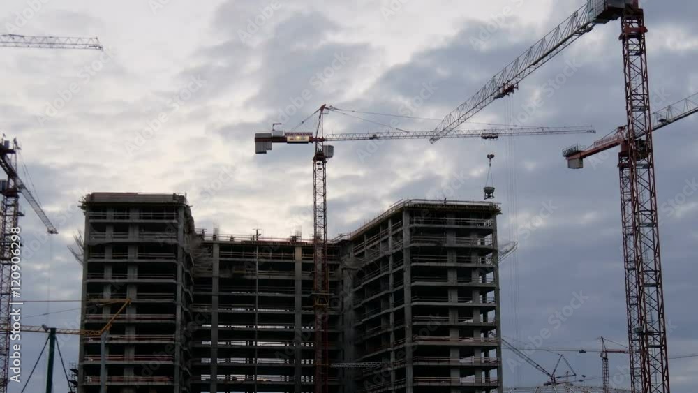 Crane working in big construction site Crane working in big construction site