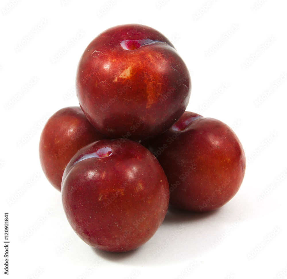 ripe purple cherry plums isolated