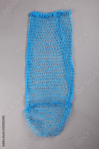 Harvest gear of nylon grass nets for fishing on grey background