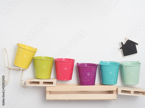 Bucket color with wood background © anon