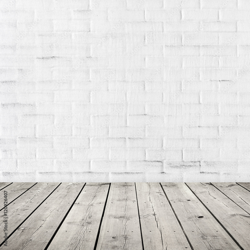 Gray wooden floor and white brick wall