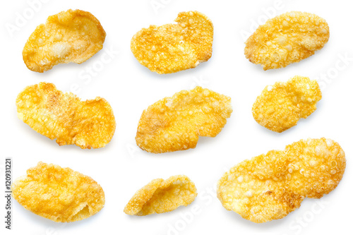 Collection of nine various shapes of cornflakes isolated.