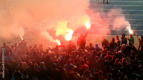 Violent ultras lighting flares at football arena, hooligans sabotaging game
 photo