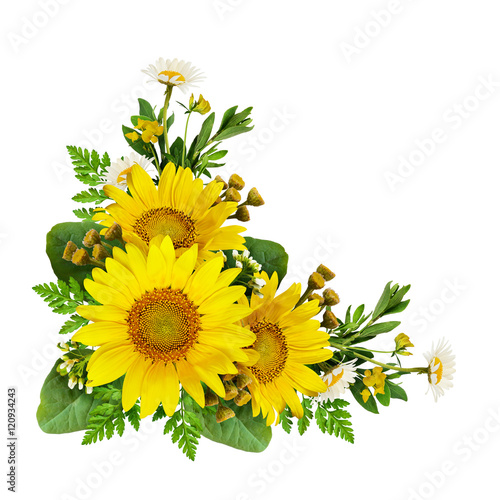 Sunflowers and wild flowers in a corner arrangement