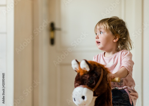 Canvas Print Child on rocking horse