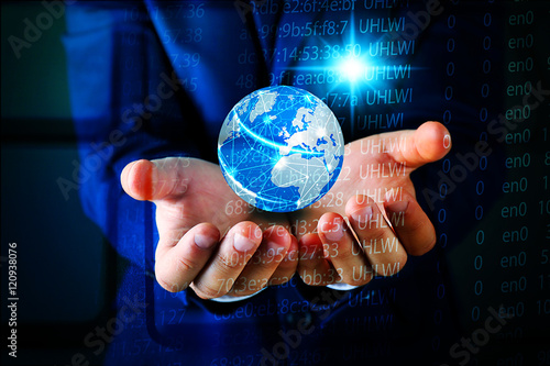 Businessman holding digital earth in hands. Technology concept.