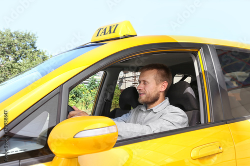 Handsome taxi driver sitting in car © Africa Studio