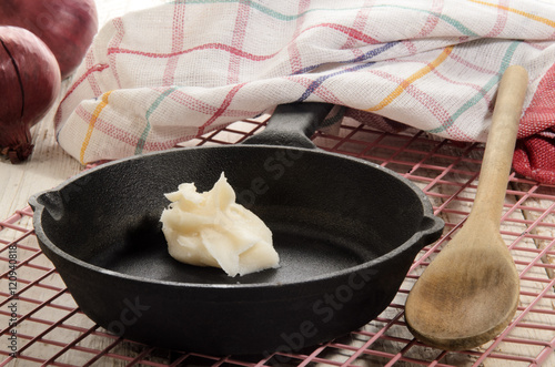 pork lard in a cast iron pan photo