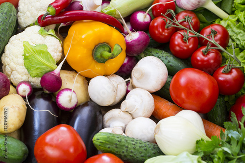 Background of fresh vegetables and greens closeup