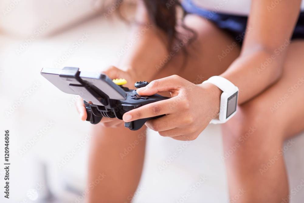 Pleasant woman playing video games Pleasant woman playing video games